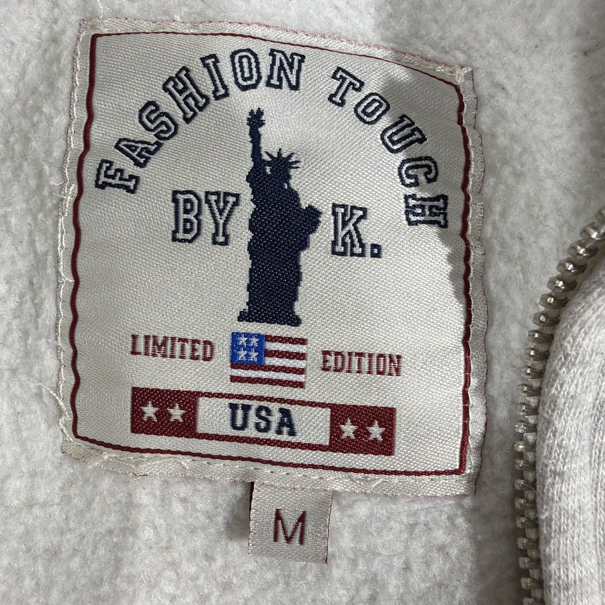 Fashion Touch by K." branded, full-zip gray sweatshirt featuring "New York City"