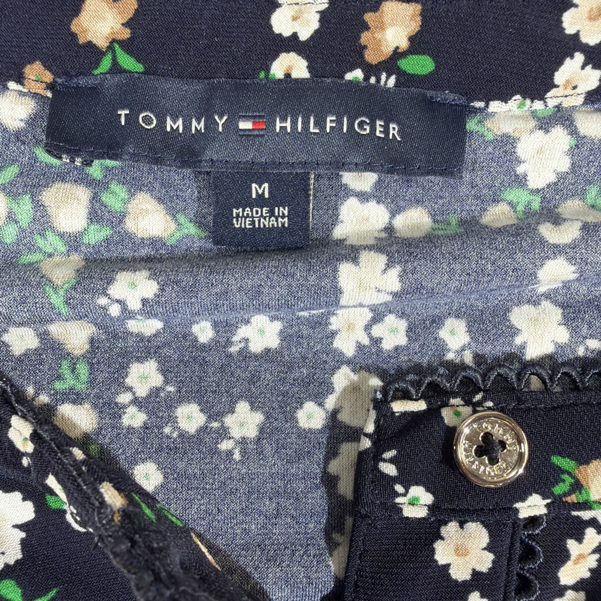 Tommy Hilfiger blouse features a dark blue base with a white plaid pattern