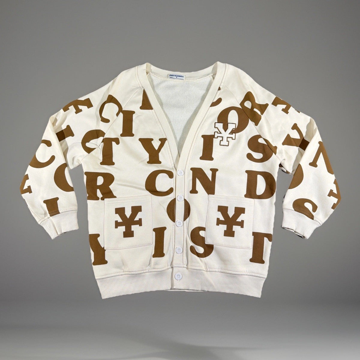 DirtyCoins brand cardigan featuring a distinctive all-over letter pattern