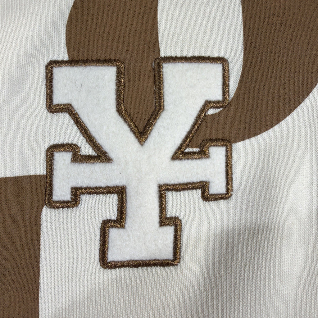 DirtyCoins brand cardigan featuring a distinctive all-over letter pattern