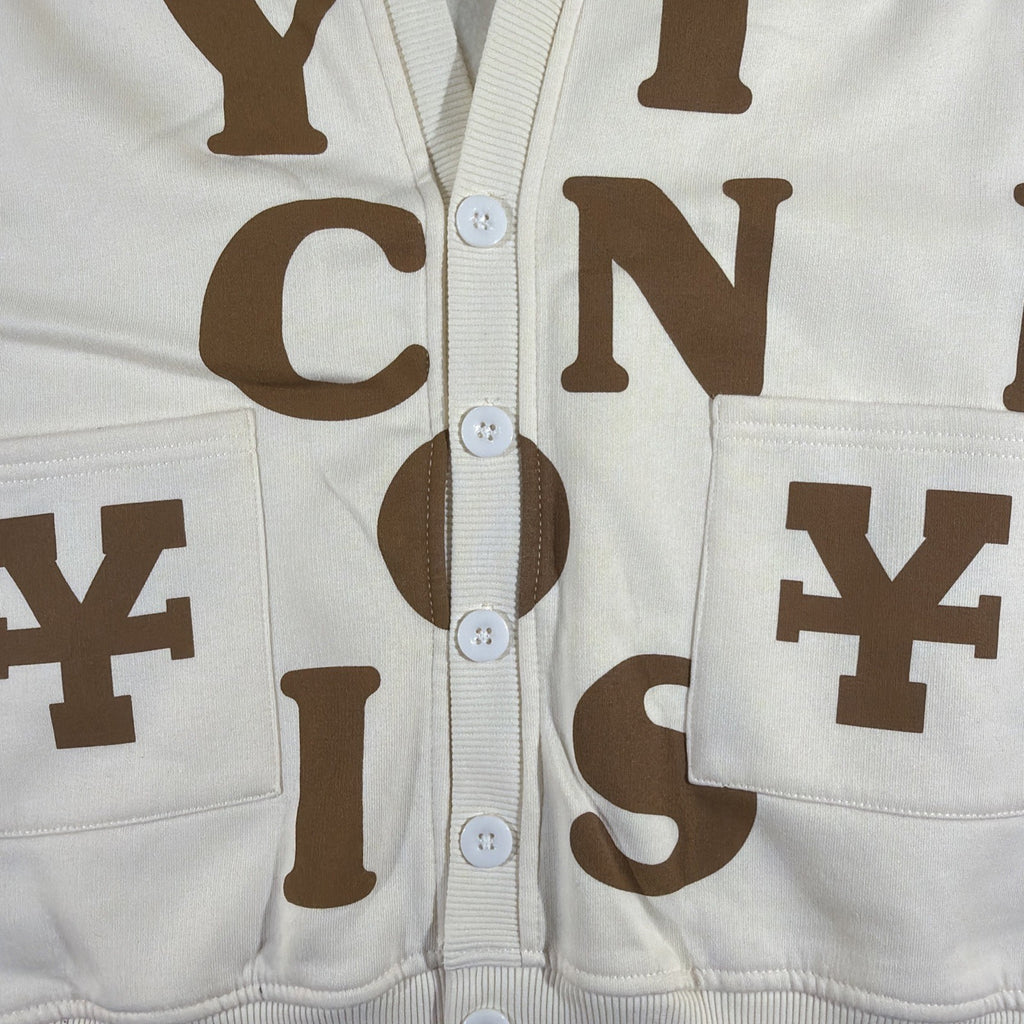 DirtyCoins brand cardigan featuring a distinctive all-over letter pattern