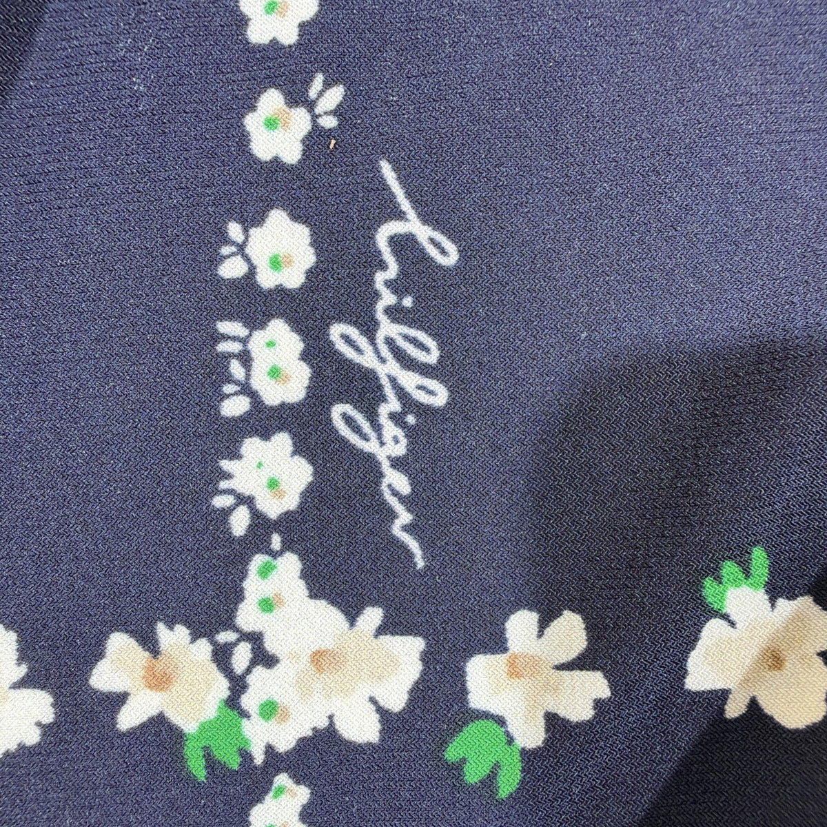 Tommy Hilfiger blouse features a dark blue base with a white plaid pattern