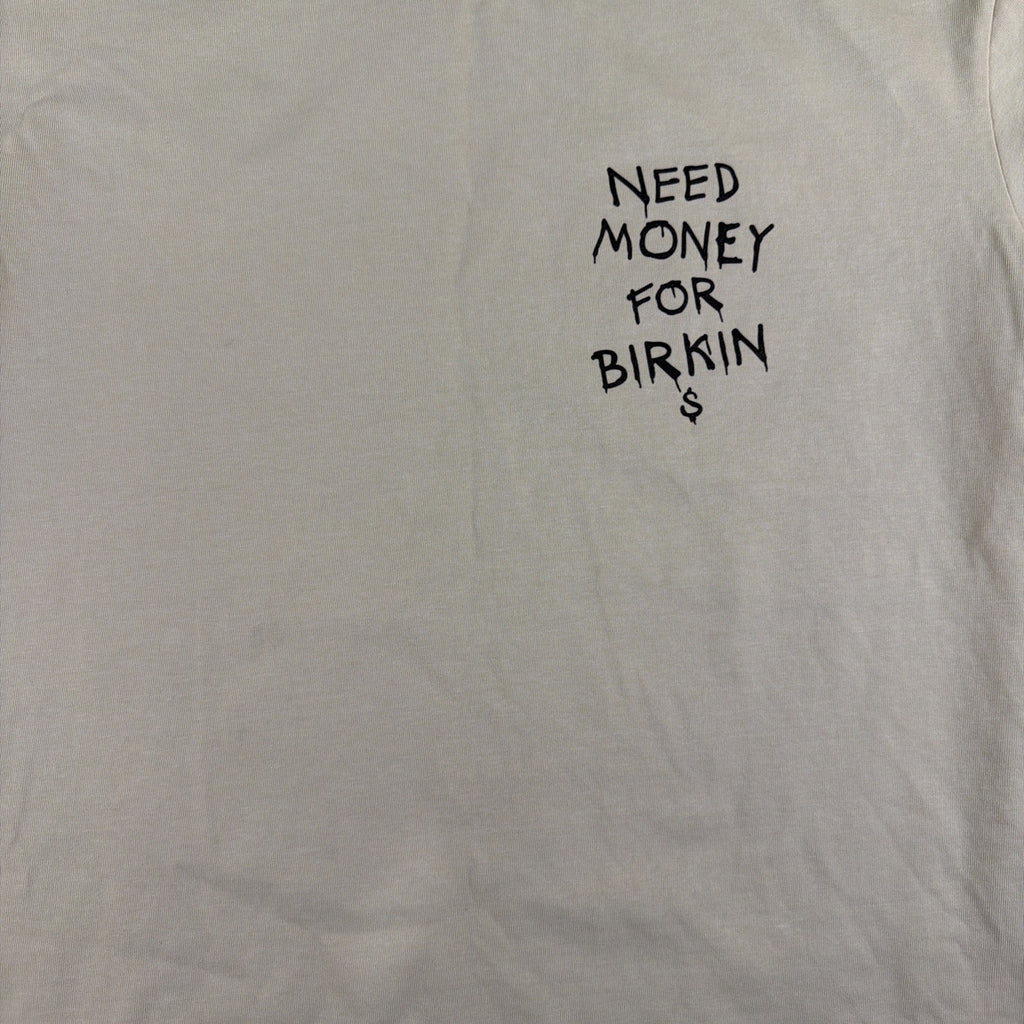 SMAKER cream-colored t-shirt features the graphics NEED MONEY FOR BIRKIN - Fashi
