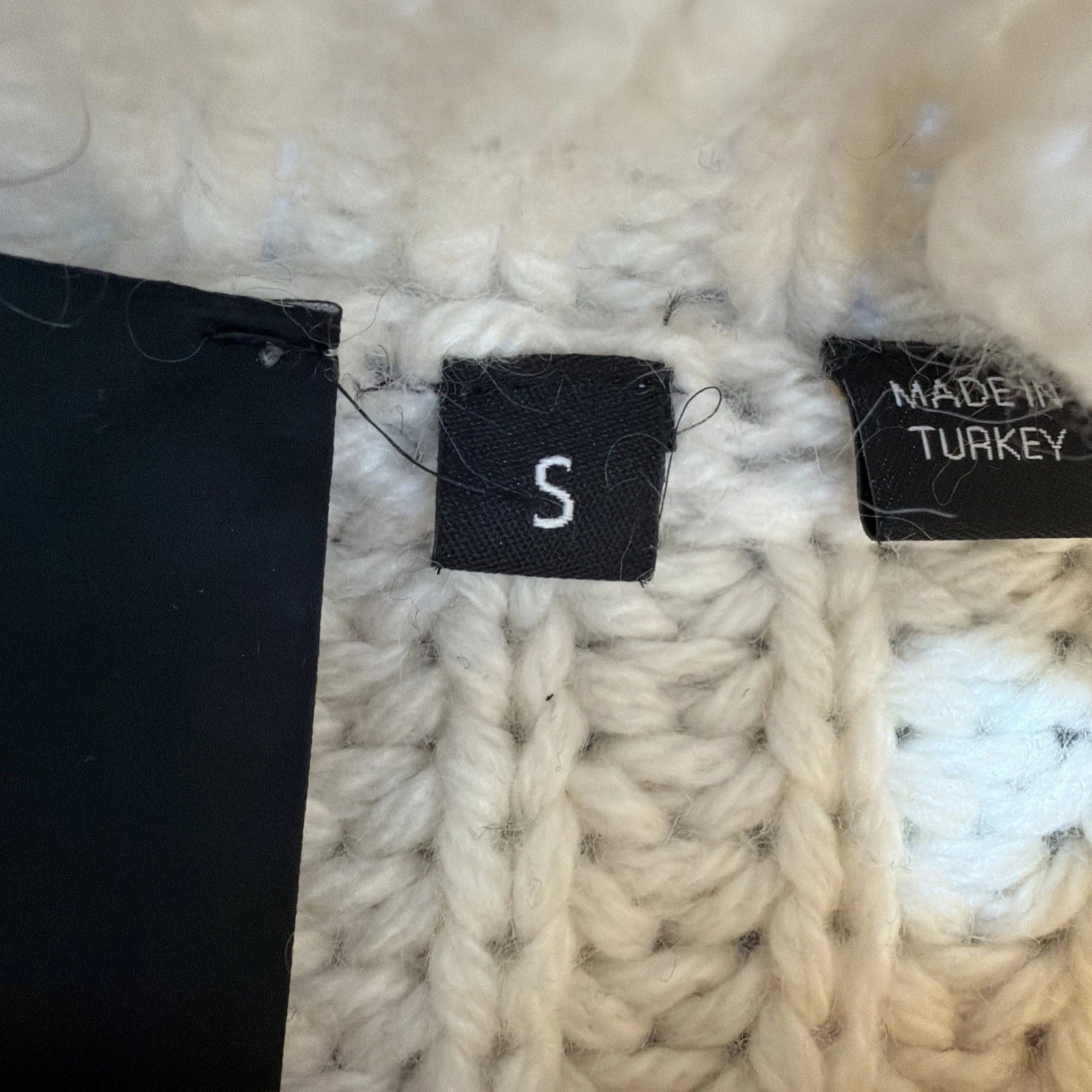 HUGO BOSS turtleneck sweater is a men's cashmere pullover in White Color