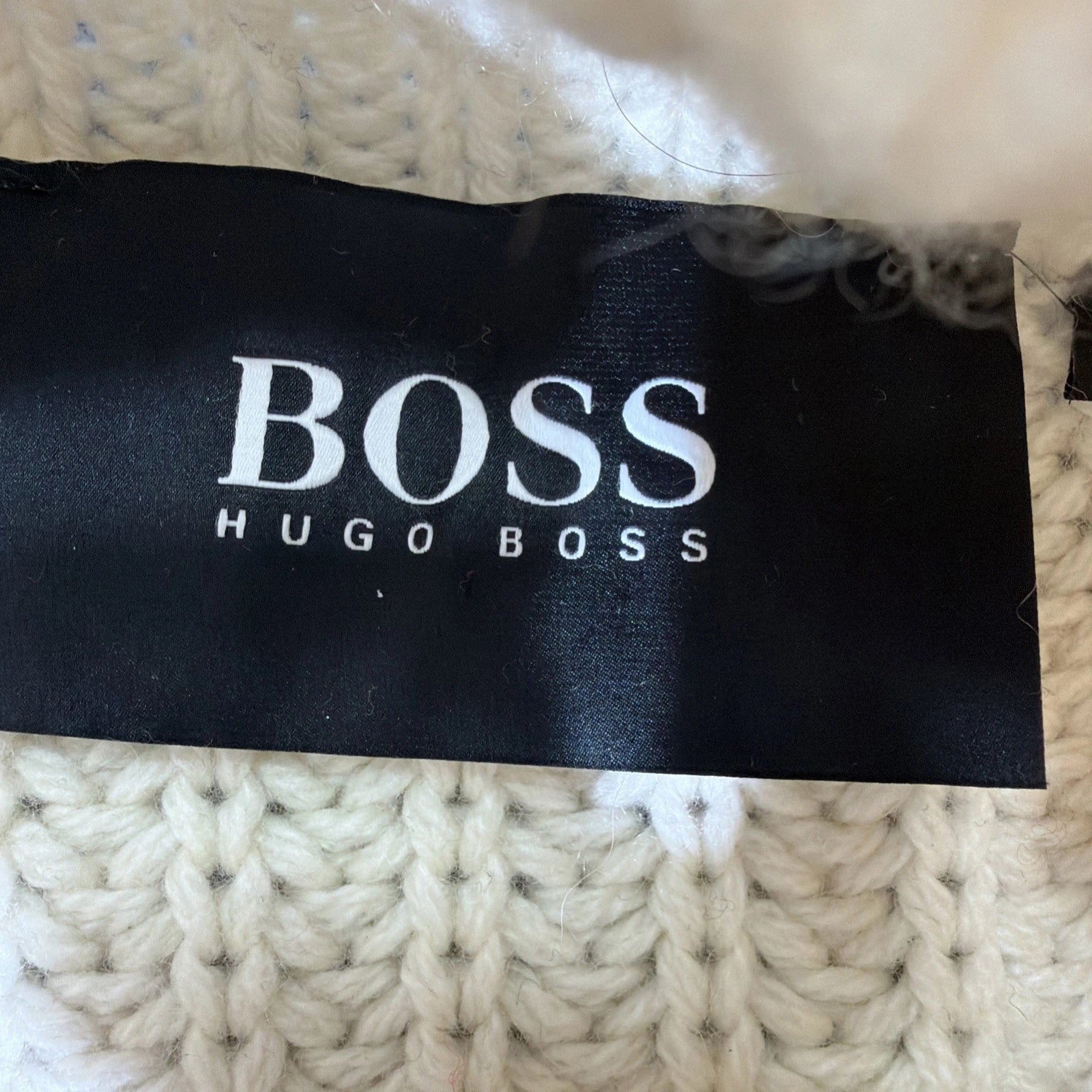 HUGO BOSS turtleneck sweater is a men's cashmere pullover in White Color